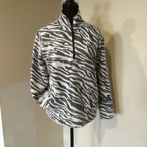Quarter-zip pullover with a stand or mock neck.